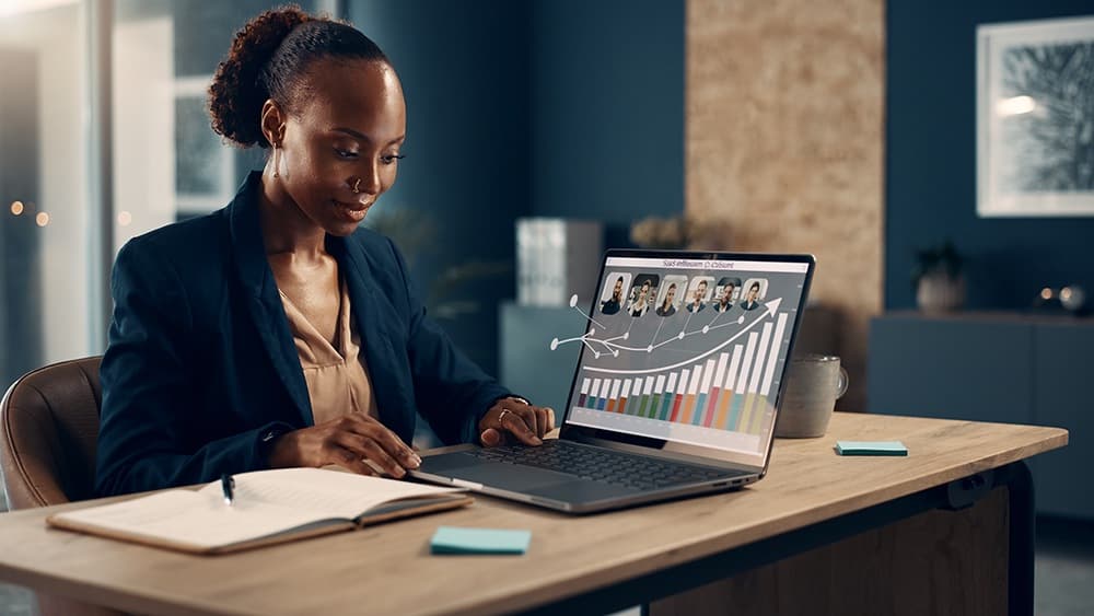 Affiliate program manager reviewing referrals partner portraits and performance charts