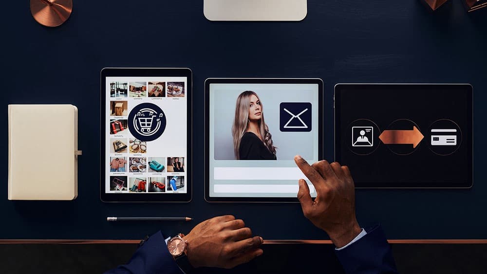 Comparison of online business software for ecommerce email marketing and sales funnels on three tablets