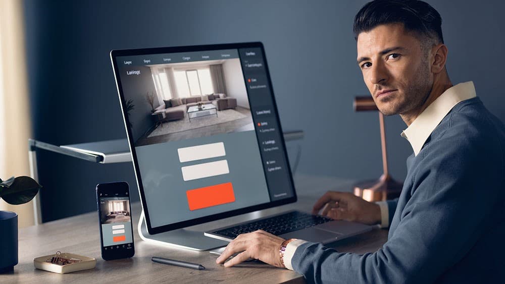 Web designer creating a lead capture landing page with desktop and mobile versions